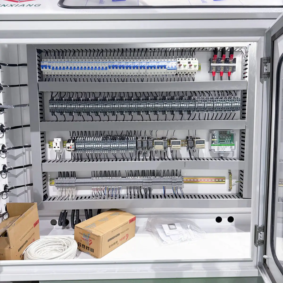 Relays, sensors and contactors inside an extruder control cabinet