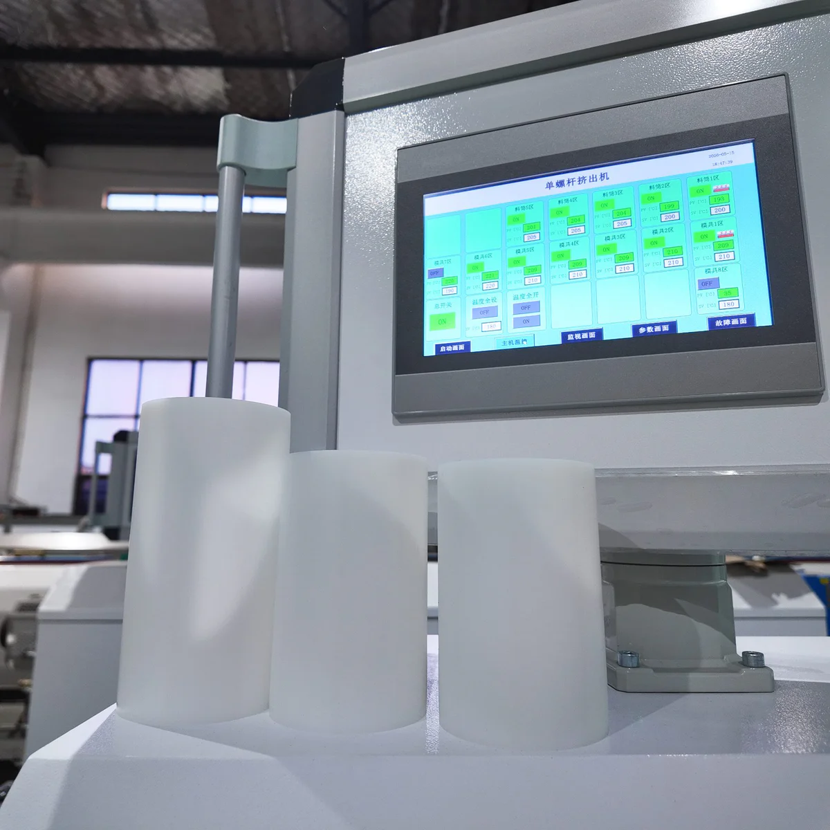 Extruder control panel showing live output during pipe production