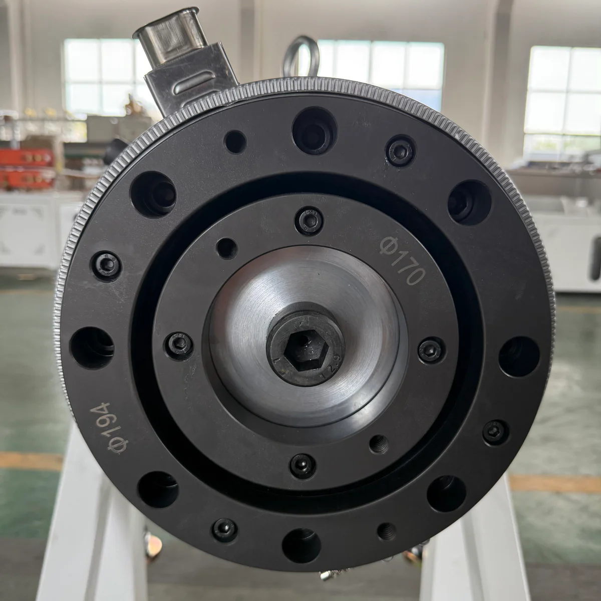 CNC machining centre cutting a die head body from solid steel