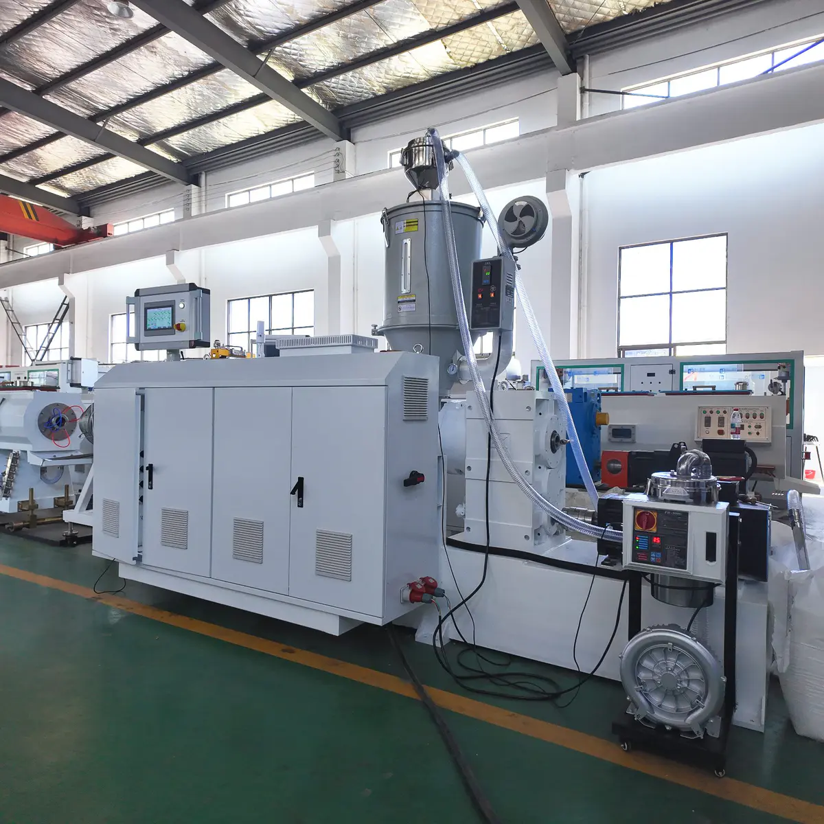 HDPE pipe extrusion line with a single screw extruder at the feed end