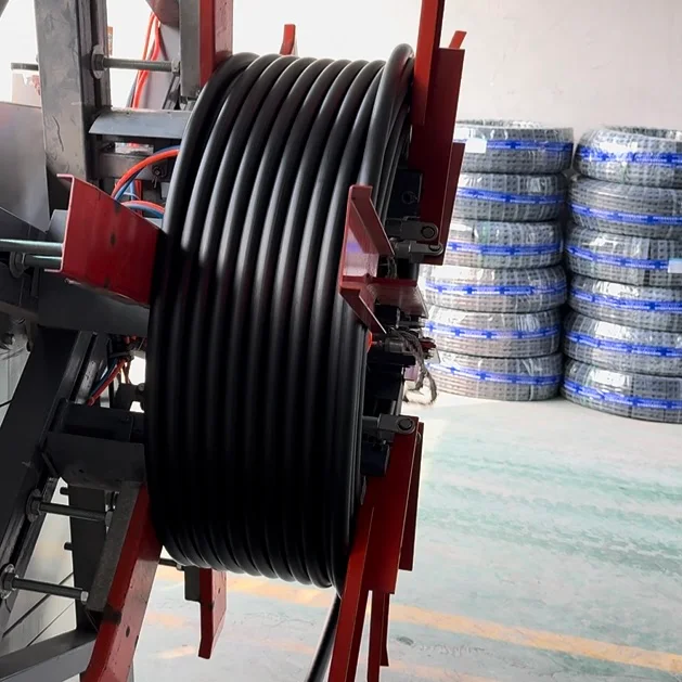 Finished HDPE pipe coil on a pipe winding machine, showing coil inside diameter, outside diameter and width