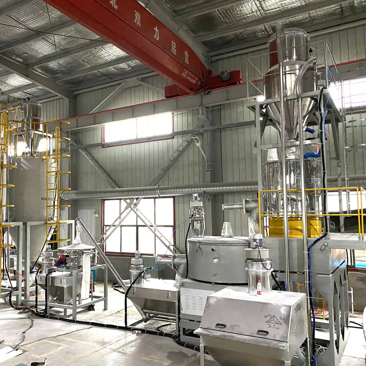 Mixer running a no-load test with a clamp meter on the motor supply