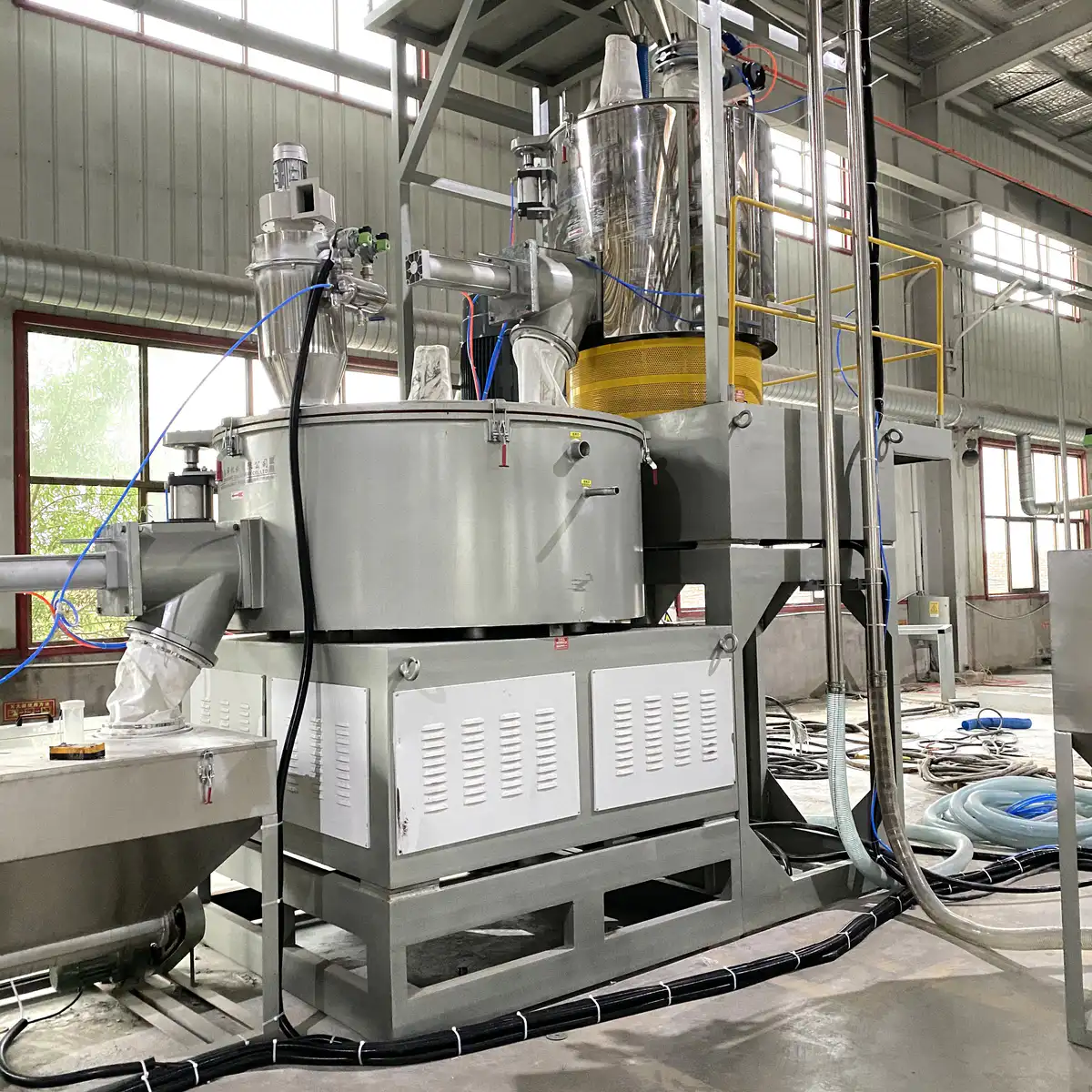 Gravimetric blender with load cells installed where a simple hopper loader used to sit