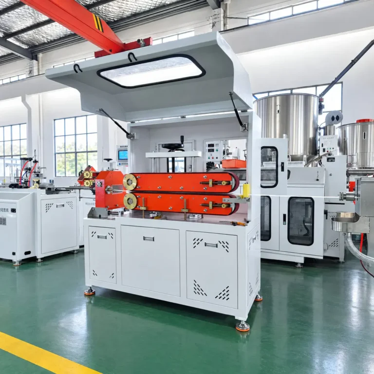 Plastic extrusion line with a haul-off unit and downstream equipment in a factory workshop with green floors and large