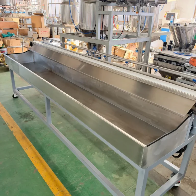 Stainless steel cooling tank with water spray pipes installed in a factory workshop
