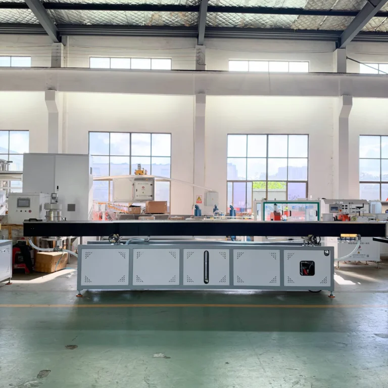 A long white cooling tank for a PA tube extrusion line with a circulating water system is installed in a bright factory