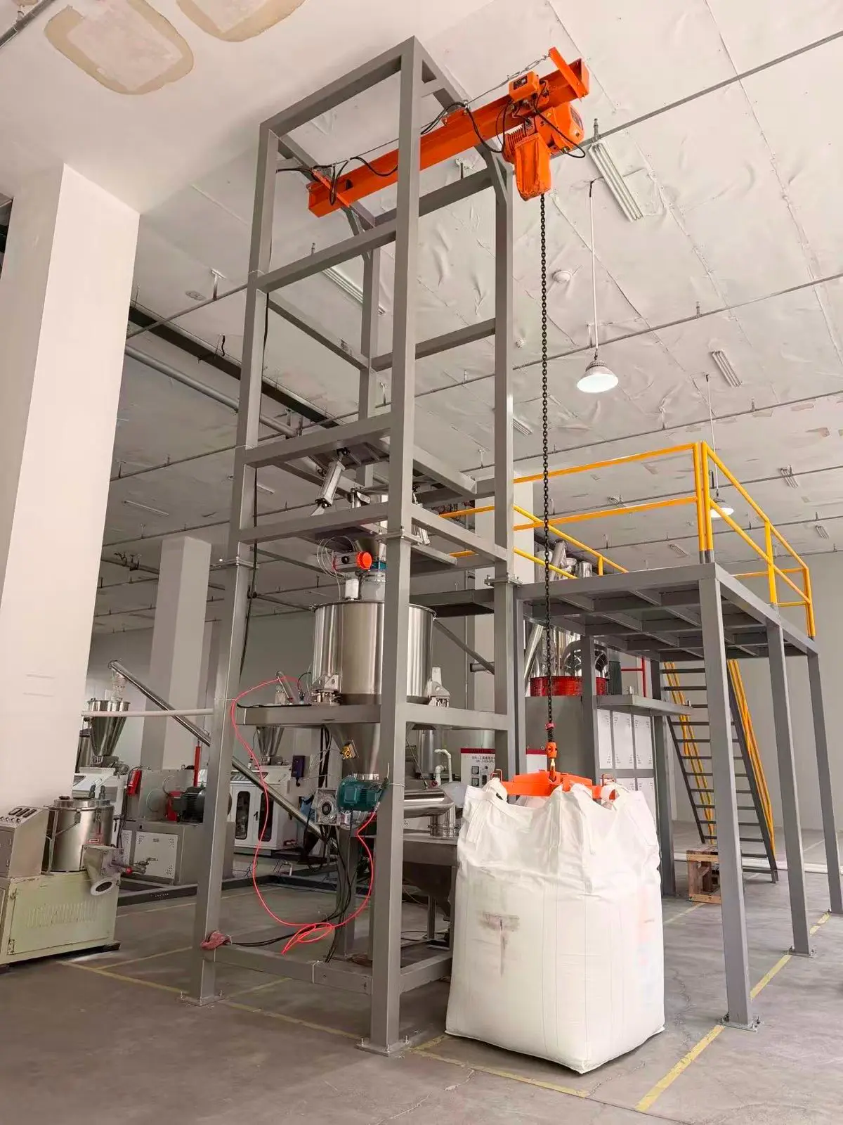 Mixer running a no-load test with a clamp meter on the motor supply