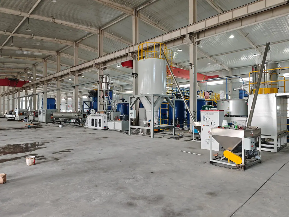 New cooling mixer and vacuum loader installed next to an existing PVC high-speed mixer