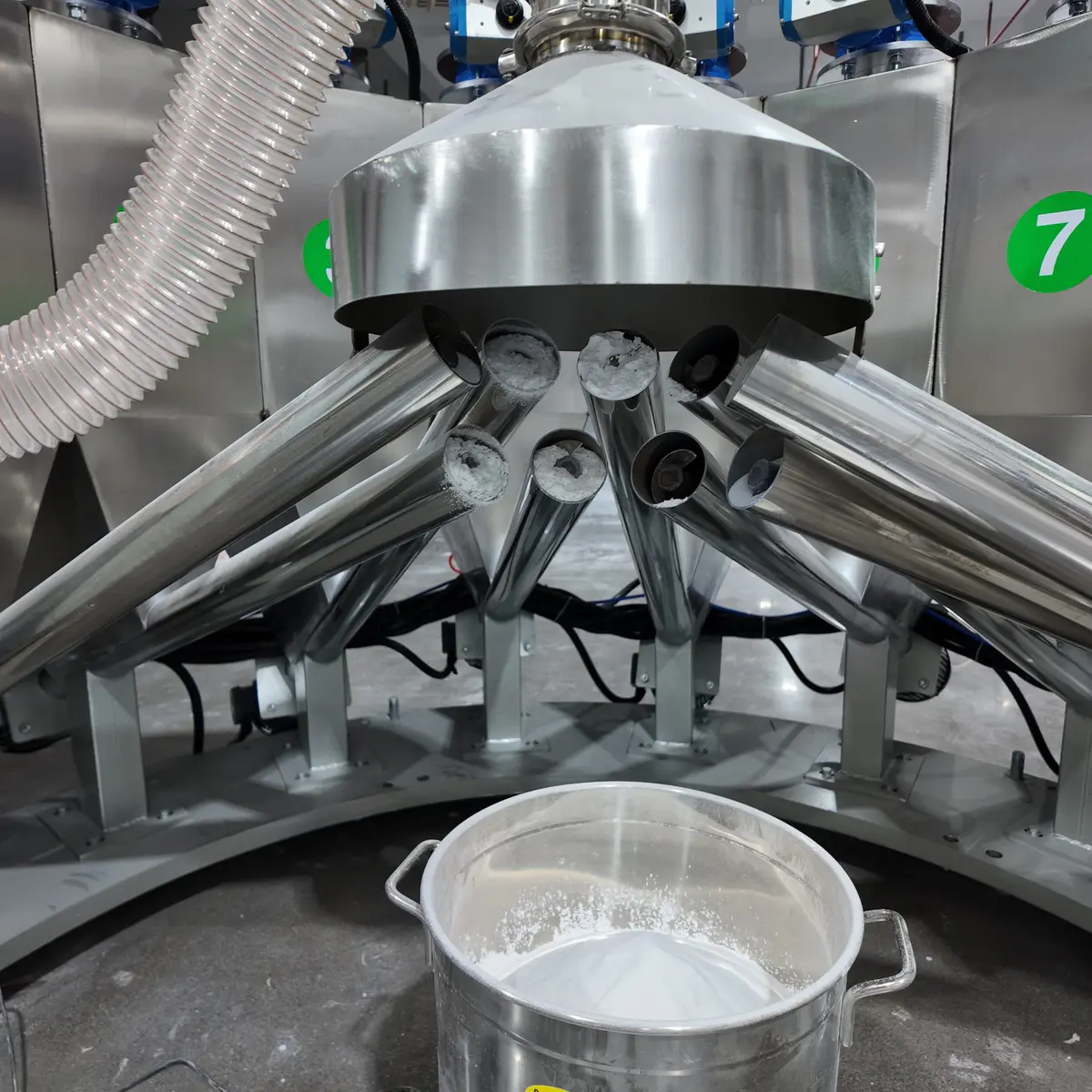 Material discharging continuously from the feeding hopper through the dosing unit during a factory test