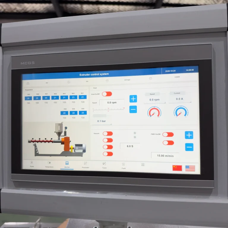 Touchscreen panel displaying an extruder control system interface with schematic diagram and process parameters in a factory