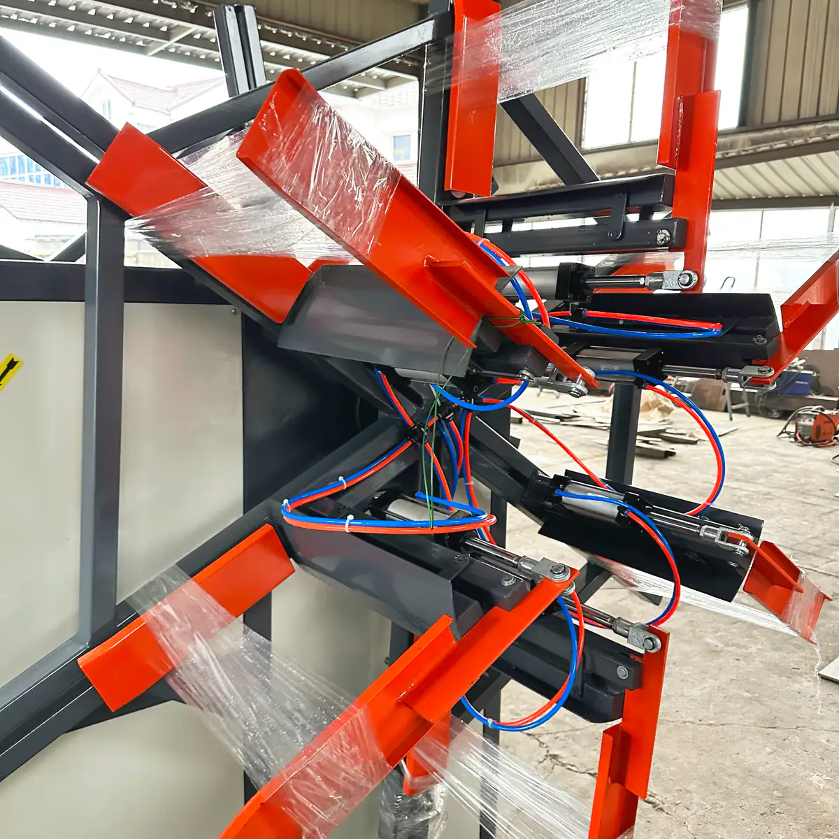 Automatic cutter on a pipe coiler cutting pipe at the target coil length