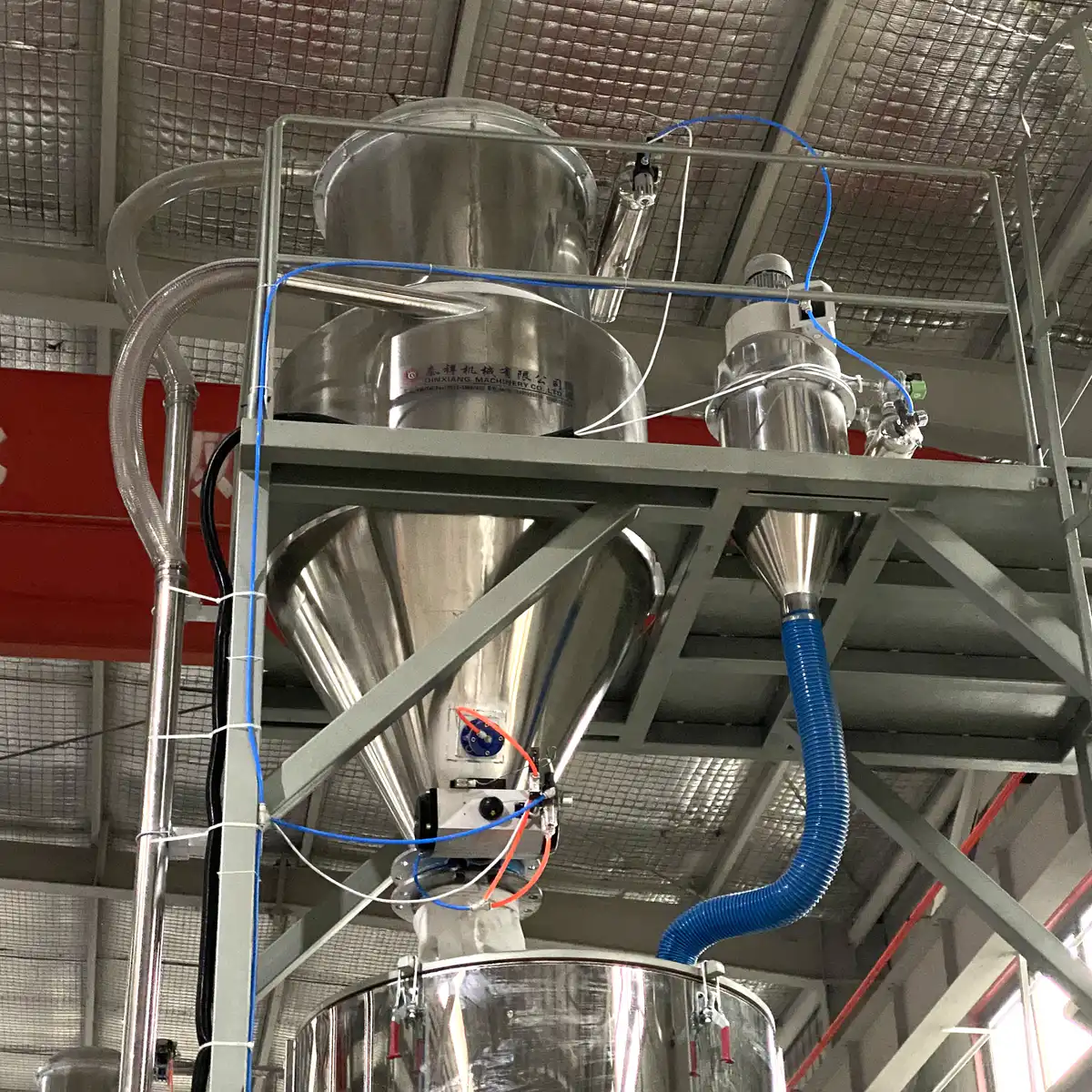 Open mixer vessel and discharge valve inspected for residual material after a batch